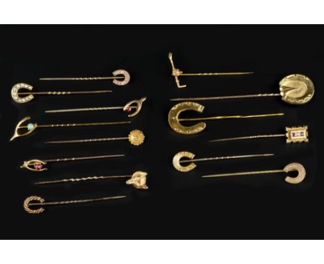 OF SPORTING INTEREST: A COLLECTION OF NOVELTY STICK PINS, comprising a fox's mask stick pin, with circular red stone eyes, st