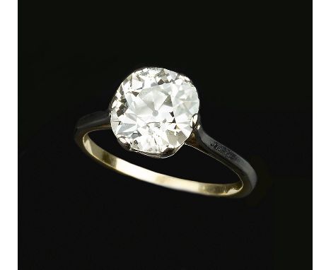 A DIAMOND SINGLE STONE RING, the cushion-shaped old-cut diamond in six claw setting, two colour precious metal mounted, ring 