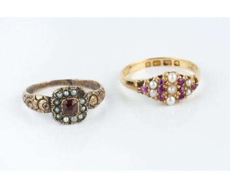 TWO HALF PEARL AND GEM SET DRESS RINGS, the first a garnet and half pearl panel ring, with tapered floral engraved shoulders,