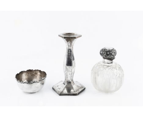 A COLLECTION OF SILVER, comprising a candlestick, of shaped hexagonal form, 18cm high; a cut glass globular scent bottle with