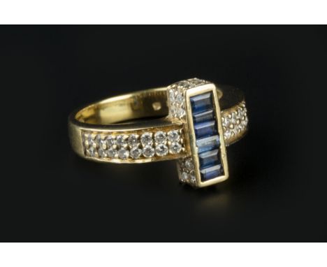 A SAPPHIRE AND DIAMOND DRESS RING, centred with a bar-shaped panel of rectangular step-cut sapphires, with a round brilliant-