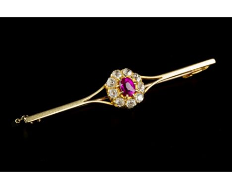 A SYNTHETIC RUBY AND DIAMOND CLUSTER BAR BROOCH, the oval mixed-cut synthetic ruby claw set within an old-cut diamond border,