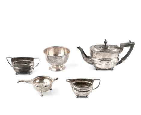 A LATE VICTORIAN SILVER BACHELOR'S THREE PIECE TEA SERVICE, of shaped oval design, the teapot with ebonised handle and knop, 