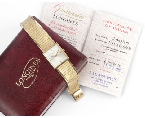A GENTLEMAN'S 9CT GOLD BRACELET WATCH BY LONGINES, the rectangular silvered dial with baton markers, to a calibre 428 jewelle