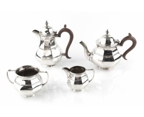 A SILVER FOUR PIECE BACHELOR'S TEA SERVICE, of octagonal faceted baluster design, the teapot and hot water pot with composite