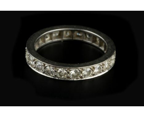 A DIAMOND FULL HOOP ETERNITY RING, set throughout with Swiss-cut diamonds, white precious metal mounted, total diamond weight