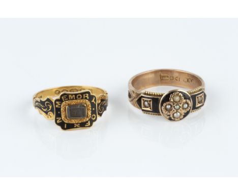 TWO ENAMEL MEMORIAL RINGS, the first with central cushion-shaped hairwork panel and black enamel foliate scroll hoop, 18ct go