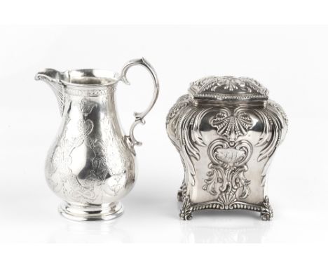 A LATE VICTORIAN SILVER TEA CADDY, of shaped rectangular baluster form, repoussé decorated with scallops and scrolling foliag