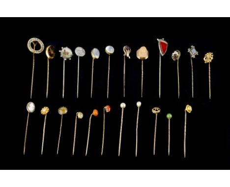 A COLLECTION OF STICK PINS, to include two diamond single stone stick pins, a blue enamel ivy wreath stick pin, (adapted), tw