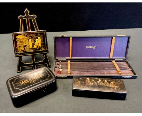 A Japanese lacquered easel letter rack;  similar box;   set of ten R Wurach Berlin pins bars, each with circular coloured dis