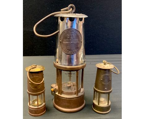An Eccles ‘Protector lamp and lighting company’ miners lamp, type GR6S, no B2/233, named Peter Mooney, 33cm high overall, two