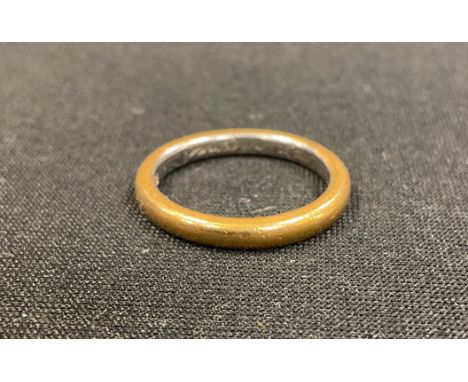 A platinum and 22ct gold wedding band, I Like My Choyce engraved to inner rim, stamped platinum 22ct, size L/M, 5g gross 