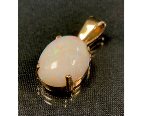 A large oval white opal cabochon pendant, approx 16.35mm x 12.42mm x 5.79mm, 9ct gold mount, Birmingham 1956, 3.6g gross