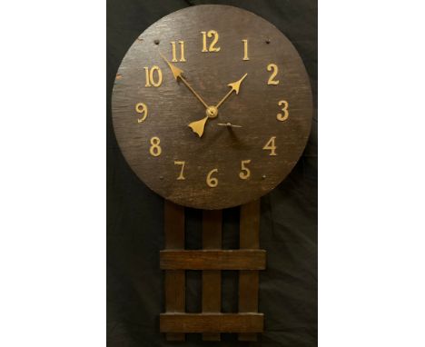 An Arts &amp; Crafts oak cased wall clock, brass Arabic numerals, arrow hands, mechanical 8 day movement, 75cm high, 41cm dia