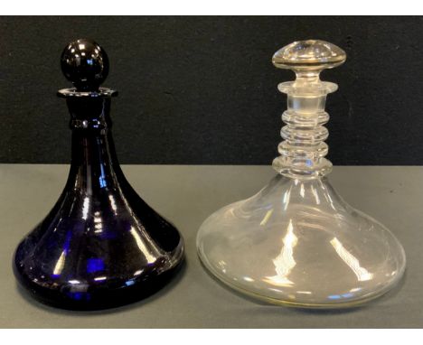 A 20th century ships decanter, possibly Dartington crystal, four collar ring neck, 24cm high, 23cm diameter;  another blue gl