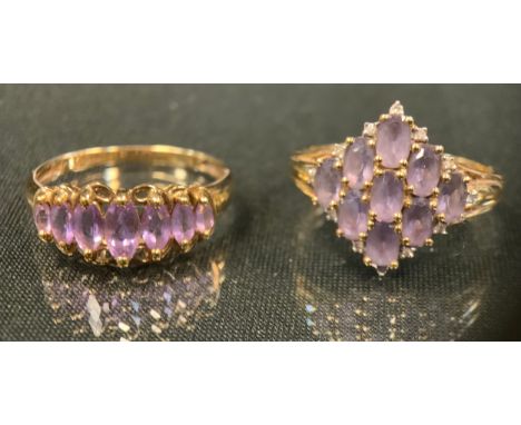 A 9ct gold navette cluster ring, set with nine pale purple oval stones, twelve diamond accents, 9ct gold shank, size U, 3.6g 