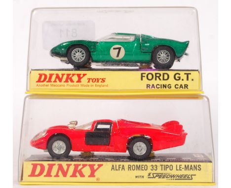 Two original vintage Dinky Toys diecast model racing cars. Each appears near mint, within the original display boxes. No. 215