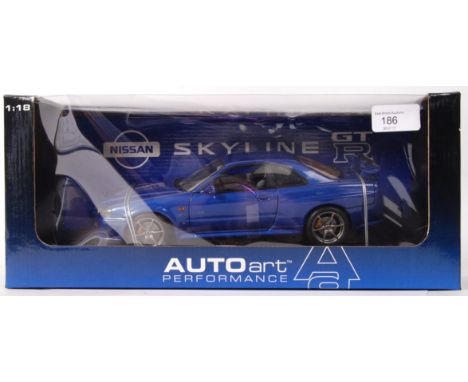 An Autoart 1:18 scale precision detail diecast model Nissan Skyline, in blue. Appears mint and unused, within the original di