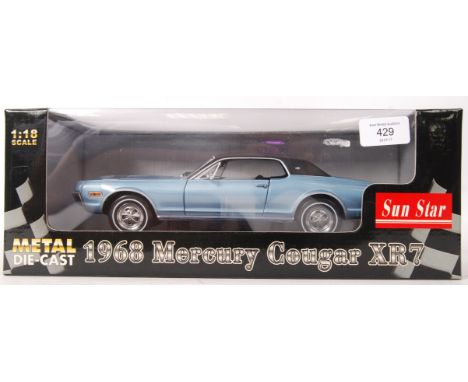 A Sun Star made 1:18 scale precision diecast model 1968 Mercury Cougar XR7 in blue. Appears mint and unused, within the origi