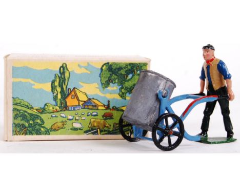 An original vintage Britains Farm lead / hollowcast figure set 5034 ' Man With Tank On Wheeled Carrier .' Appears near mint, 