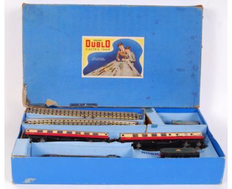 A vintage Hornby Dublo Electric Train set, with Duchess Of Montrose 46232 locomotive. With tender and tinplate carriages. Box
