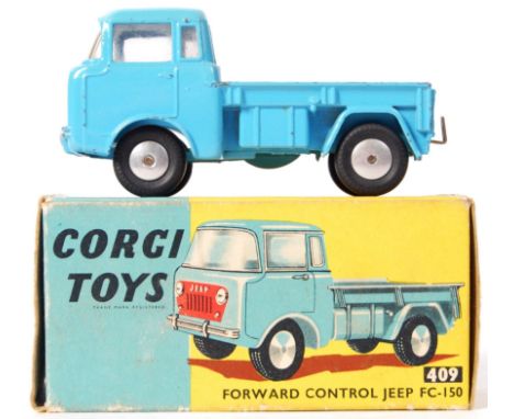 An original vintage Corgi Toys diecast model No. 409 Forward Control Jeep FC-150. Appears within the original box.
