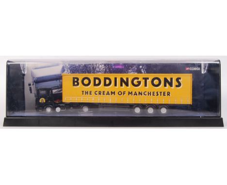 An original Corgi 'Modern Trucks' series diecast model ERF Curtain side Boddingtons truck, 75202. Within its original plastic