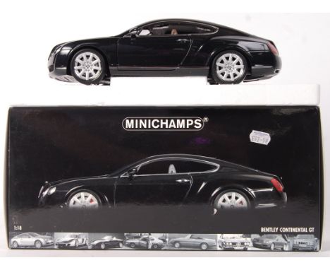 A Minichamps made 1:18 scale precision diecast Bentley Continental GT. Appears mint+, within the original box. Still affixed 