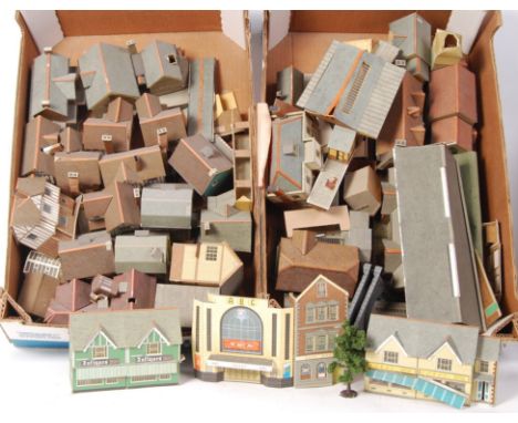 A large collection of assorted 00 gauge 1:76 scale model railway trainset trackside buildings, churches and related scenery. 