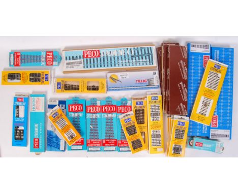 A large collection of assorted vintage and contemporary mostly Peco made points / special track pieces. All boxed. To include