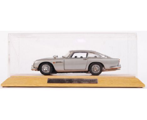 A James Bond 007 Danbury Mint 1:24 scale precision diecast model Aston Martin DB5. Appears complete, with certificate and ins