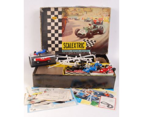 A vintage Scalextric set ' 50 ,' boxed. Along with various other Scalextric cars, instruction manuals etc. Contents unchecked