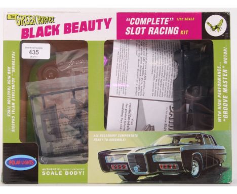 A Green Hornet Black Beauty 1:32 scale slot racing car model kit made by Polar Lights. Appears complete and unmade (unchecked