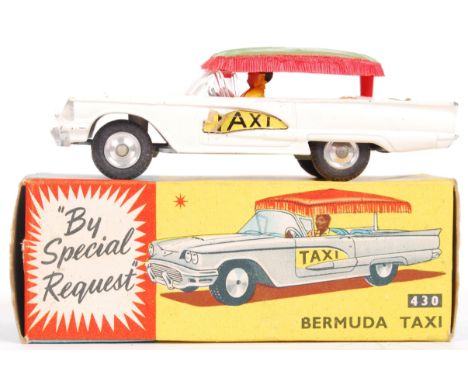 An original vintage Corgi Toys diecast model No. 430 Bermuda Taxi. White, with plastic roof. Very good model, in a good origi