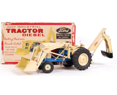 A rare vintage tinplate Cragston Corp made ' 4000 Industrial Tractor Diesel ' toy. Complete, within the original box (with ca