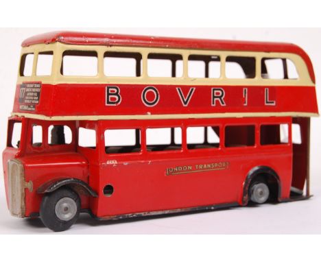 A vintage Triang Minic Toys tinplate clockwork London Transport Routemaster London Bus with Bovril livery. Appears largely fa