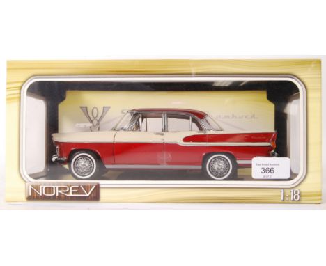 A Norev made 1:18 scale precision diecast model Simca Chambord car. In red and cream. Appears mint, unused, within the origin