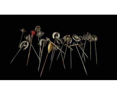 Twenty one various stick pins, one yellow metal example, Shield form, engraved with ivy, on stamped sterling, many of horse s