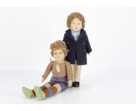 A British felt boy doll 1930s,  probably Chad Valley with brown painted eyes, brown mohair wig, swivel head, jointed felt bod