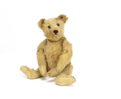 A German teddy bear 1910-1920s, with golden yellow mohair, closely