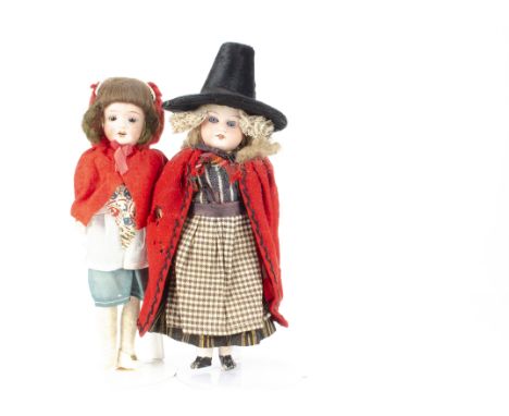 Two small  German bisque headed dolls, an Armand Marseille 390 dressed in Welsh traditional costume with blue sleeping eyes, 