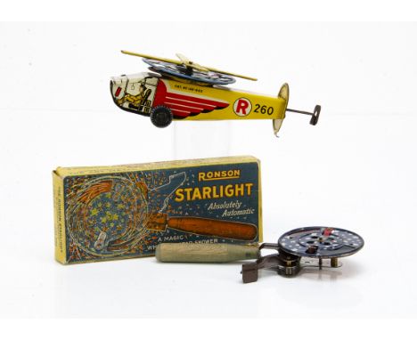 A German lithographed tinplate helicopter spark toy,  with push action causing a wheel and blades to spin and spark, lithogra