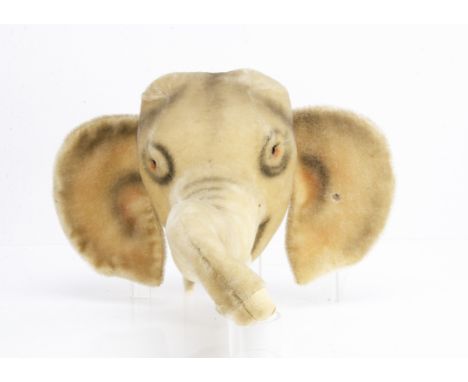 A rare Steiff elephant trophy head circa 1958, of grey mohair, black glass eyes, airbrush markings, felt tusk, script button 