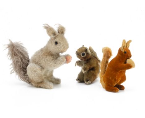 A  1930s Steiff red squirrel,  of reddish brown velvet body, mohair tail and ears,  black glass eyes, black stitched nose and