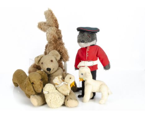 Various British soft toys, a jointed lamb with felt flower in mouth --8in. (20.5cm.) high; a post-war Chad Valley duckling wi