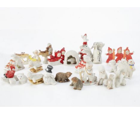 Bisque Snow Babies and children, twenty-three including a polar bear in an igloo --1 ¾in. (4.5cm.) high, two children on a sn