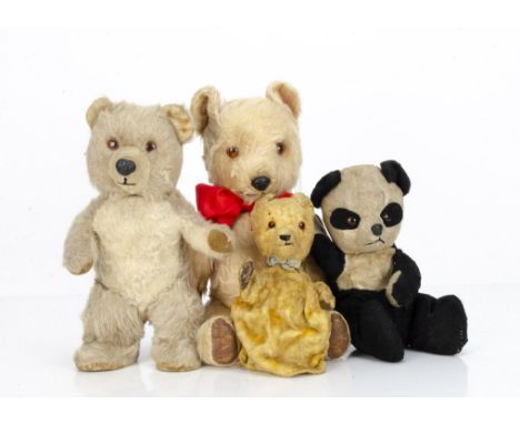 Four post-war Chiltern teddy bears,  a standing musical Bruin with beige mohair, orange and black plastic eyes, short mohair 