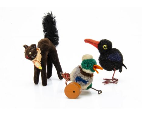 A Steiff pom-pom woollen lead drake from Duck Chain 1934-41, with grey, green, white and brown pom-pom, black button eyes, ye