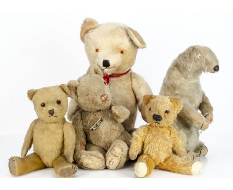 Five British teddy bears, a large post-war musical teddy bear --30in. (76cm.) high; a Dean's Ivy polar bear (worn); an Invict