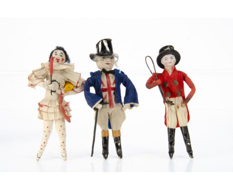 Three Christmas cracker dolls, with wired bodies and crepe paper, John Bull and a clown ---5 ¼in. (13cm.) high with cotton ba